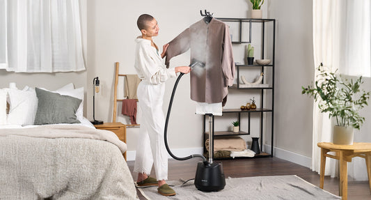 Steaming a dark jacket with the Fridja f1200 Clothes Steamer Pro at home