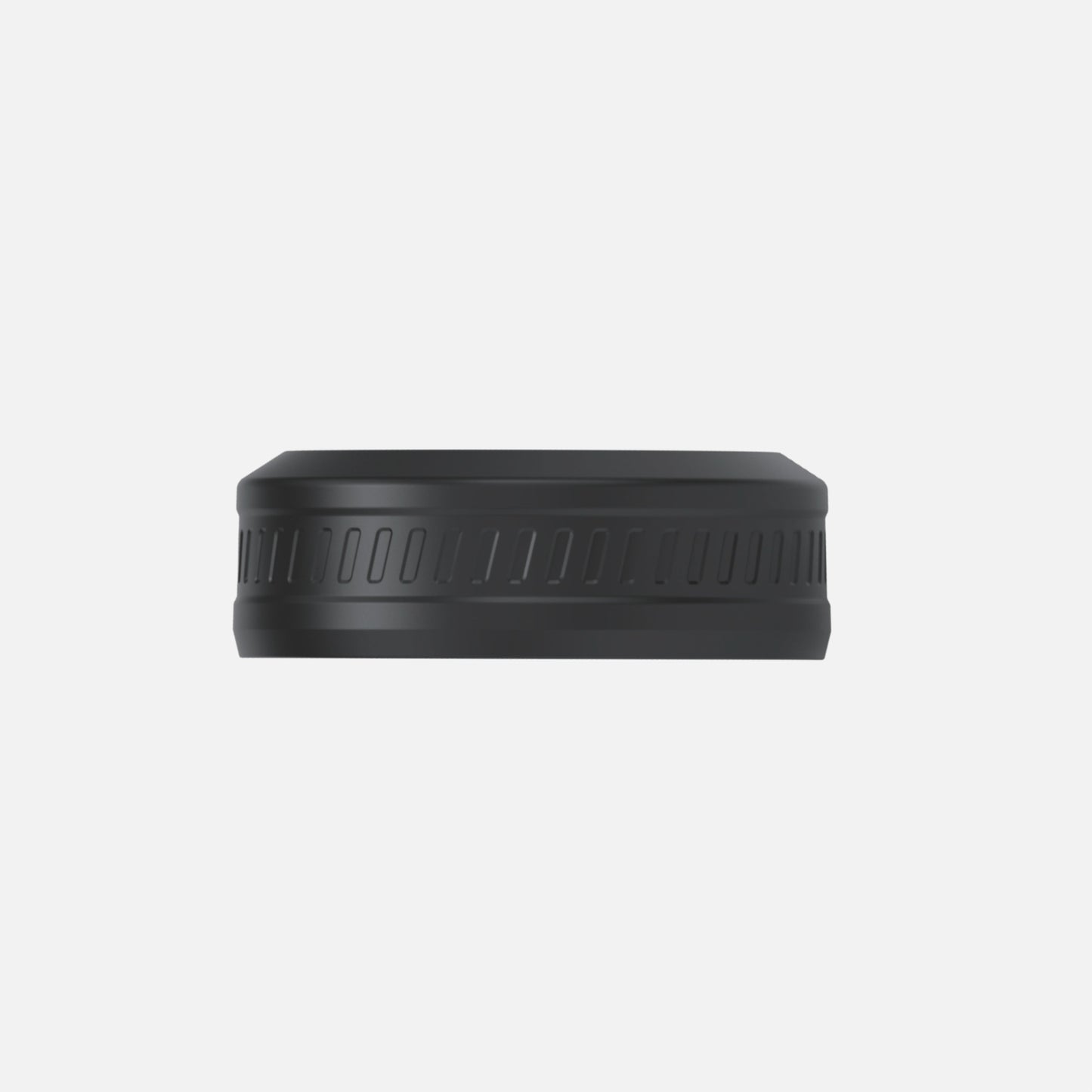 A side view of the f500 Travel Lid by Fridja—a black, textured, circular plastic bottle cap—appears against a plain white background.