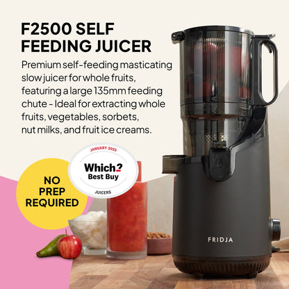 A black Fridja Citrus & Juice Duo (f800 & f2500) sits on a counter with fresh juice and fruit. Text highlights its large feeding chute, no prep needed, and a Which? Best Buy badge from Jan 2023.