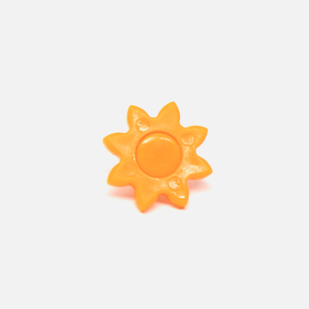A Fridja f1900 Orange Gear Cog, a plastic sun-shaped juicer component with a round center and pointed rays, is shown on a plain white background.