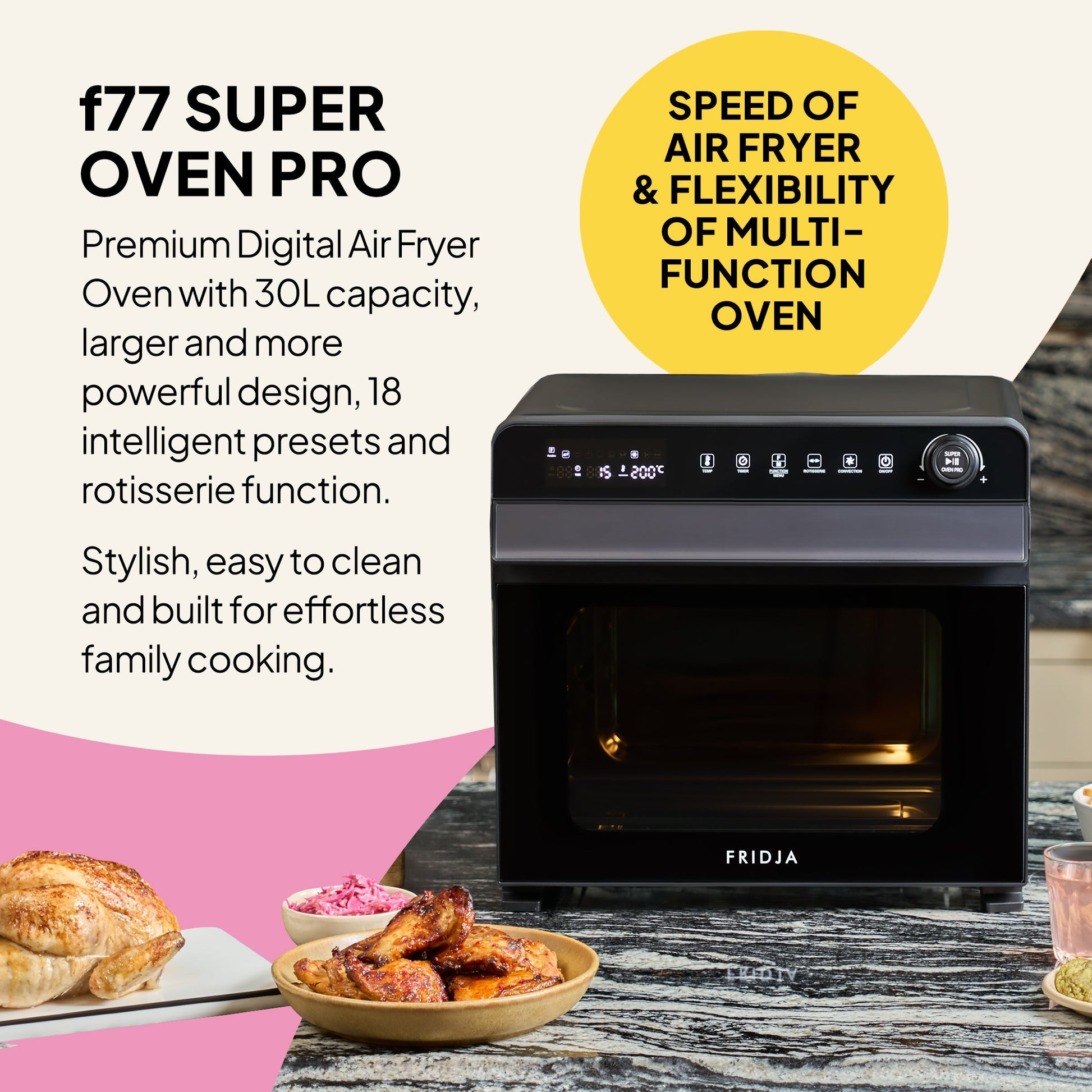 A Fridja f77 Super Oven Pro - 30L Digital Air Fryer Oven sits on a kitchen counter by cooked chicken and food bowls, highlighting its large capacity, smart presets, PFAS free build, and stylish modern design.